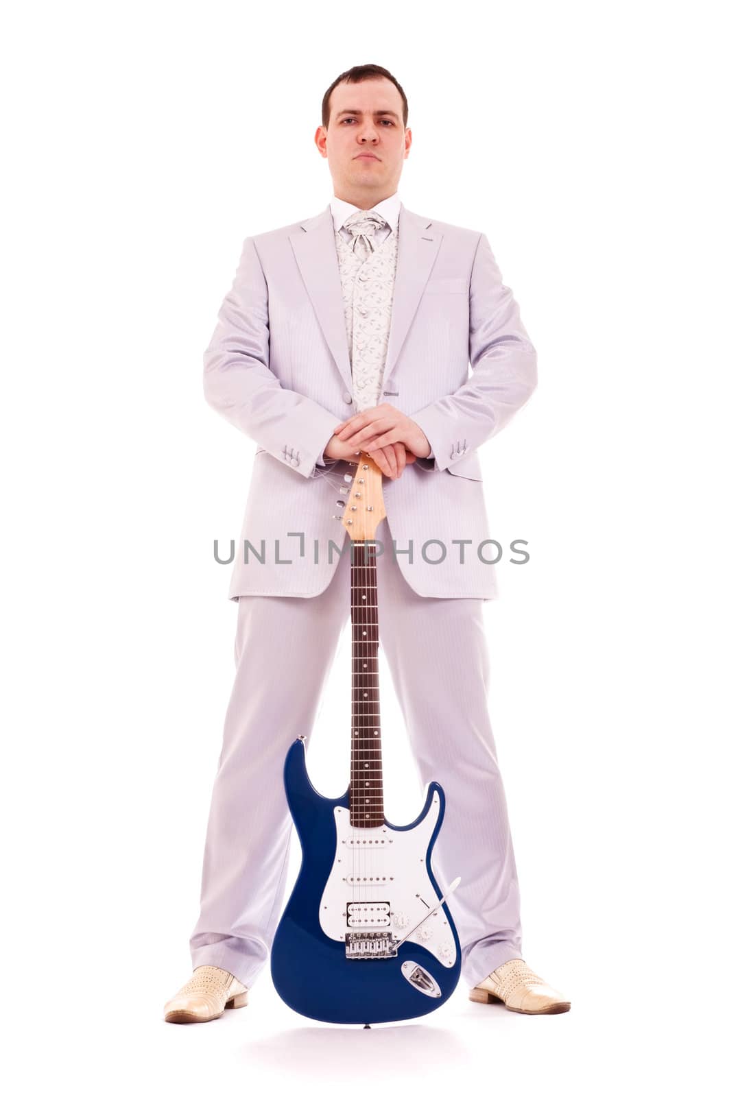 man standing with electro guitar on white background