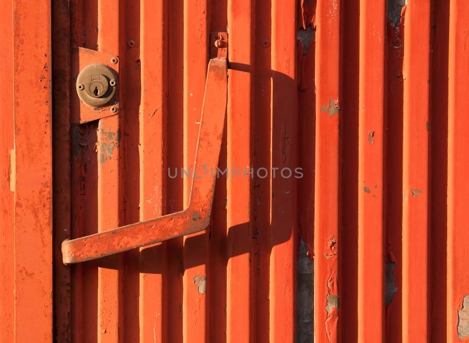 vibrant orange rusty iron door as a background or texture