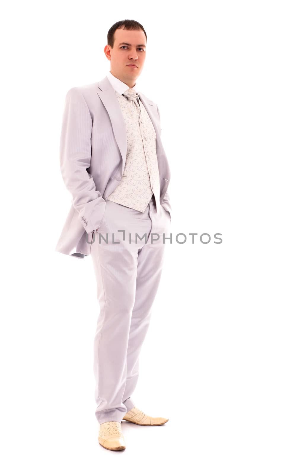 young man in wedding suit isolated on white background