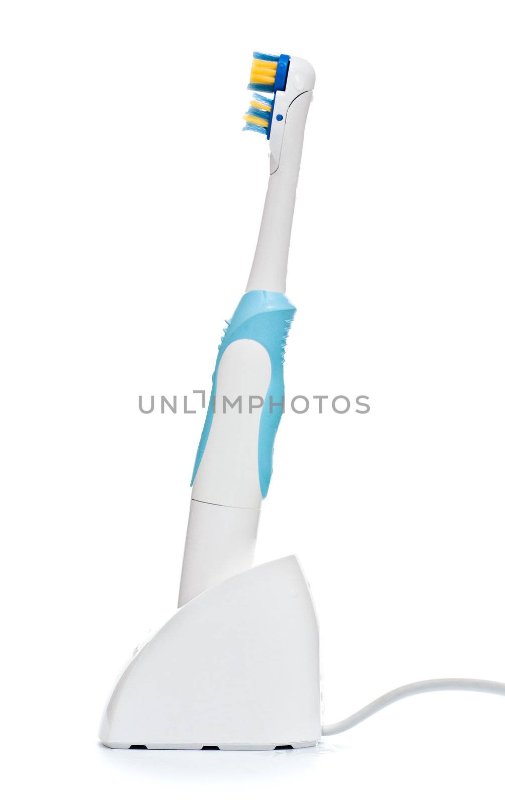electric toothbrush on stand isolated on white background