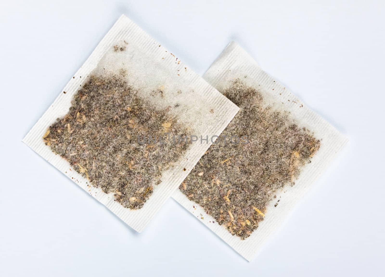 herbal tea bags laying on table by petr_malyshev