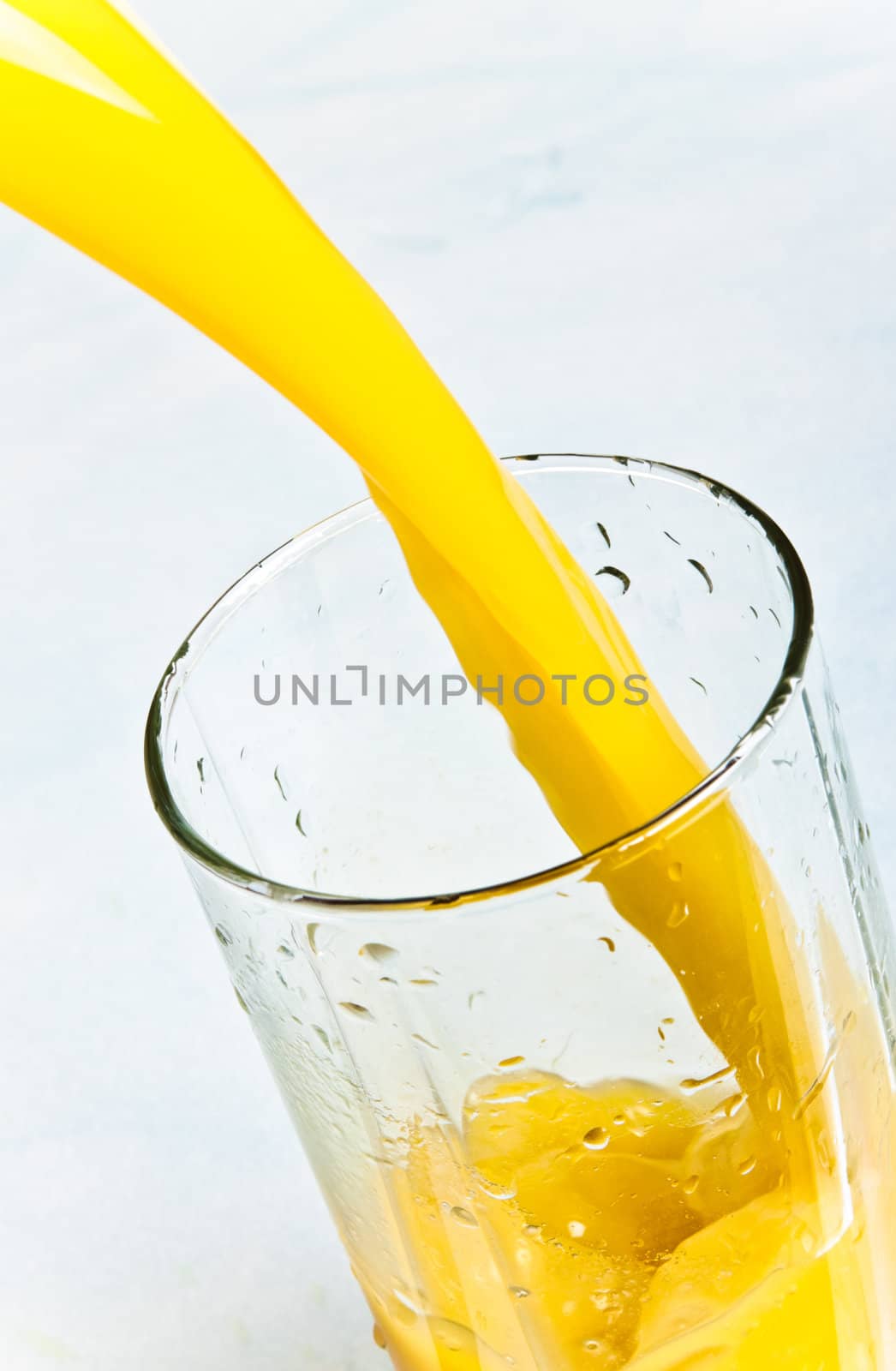 juice is poured into a glass closeup