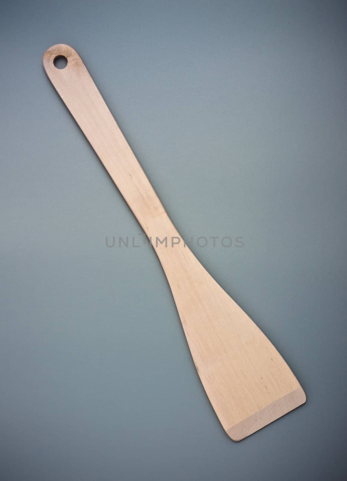 wooden kitchen spatula on grey background