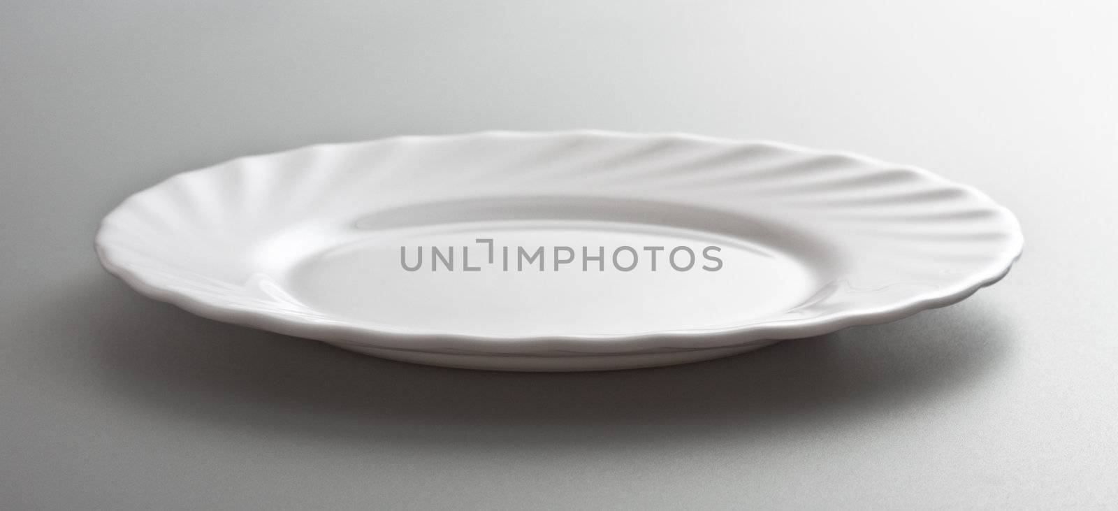 empty white dish by petr_malyshev