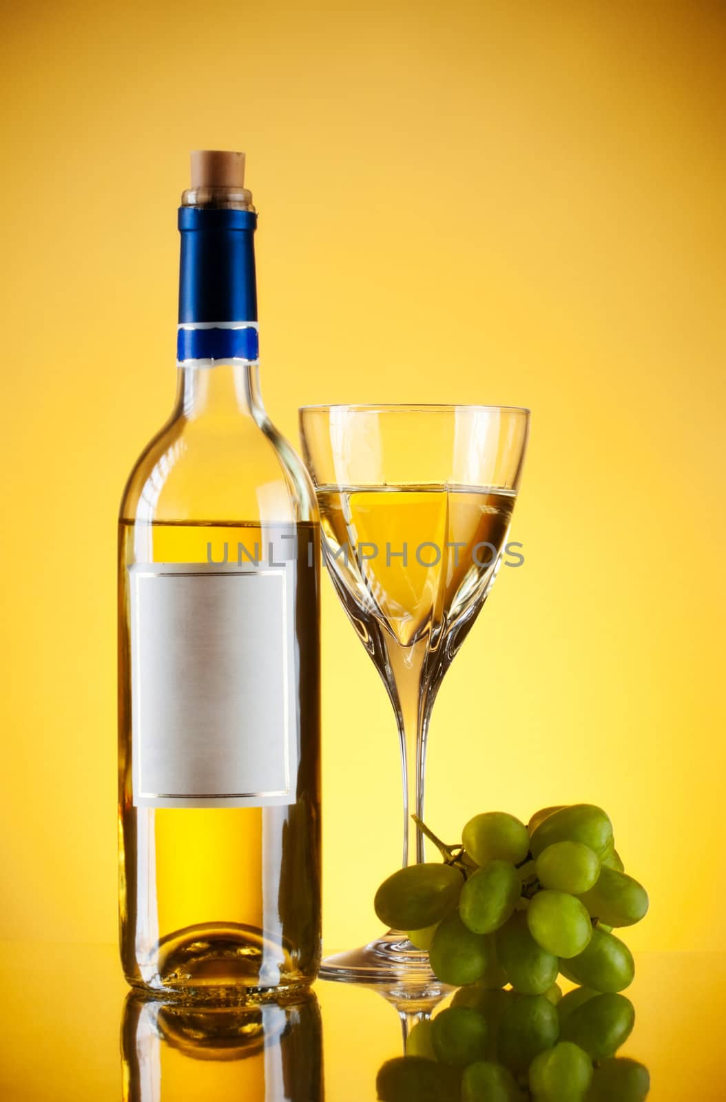 bottle and glass of wine, grape bunch, yellow background