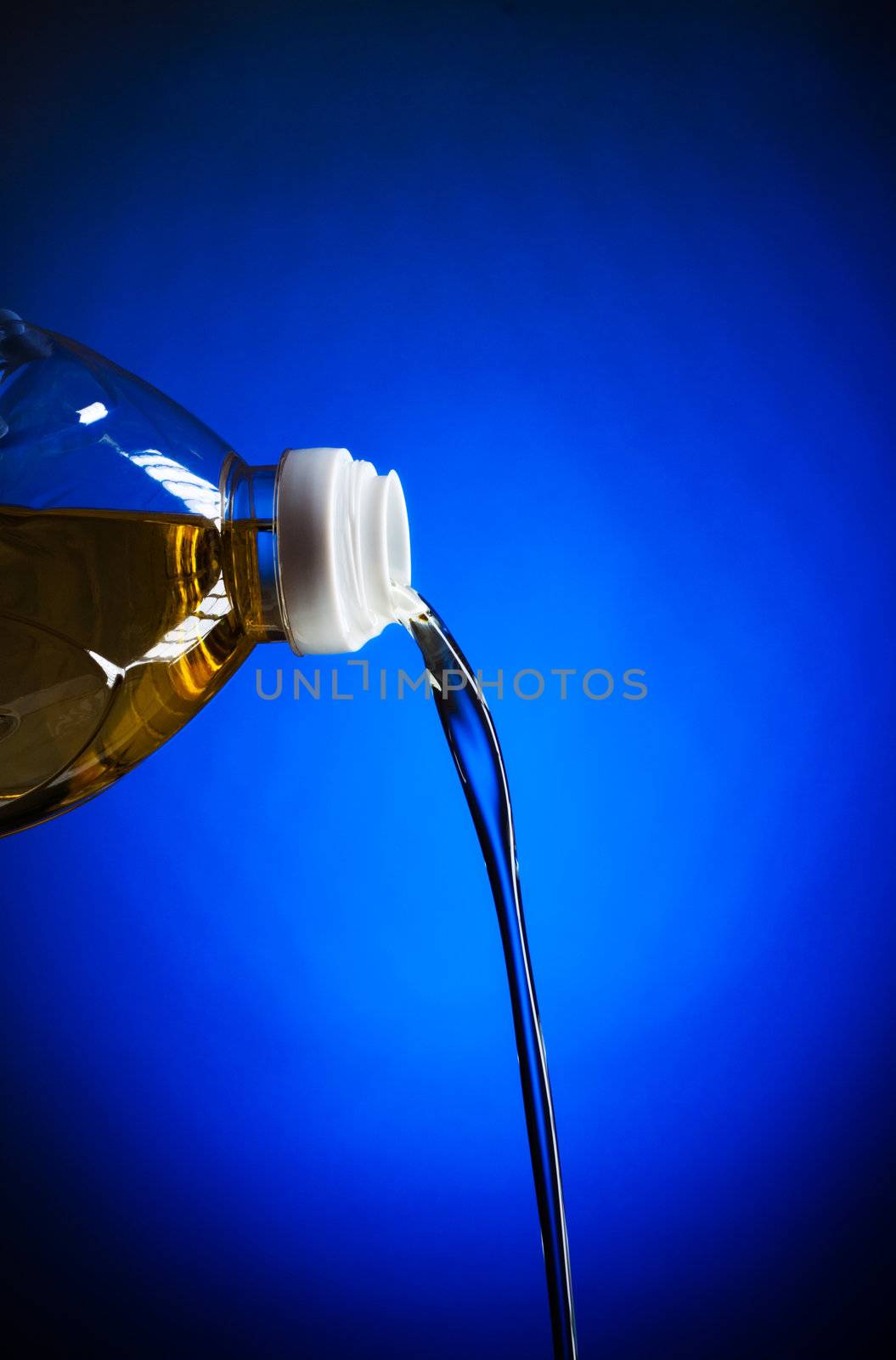 pouring oil, blue background