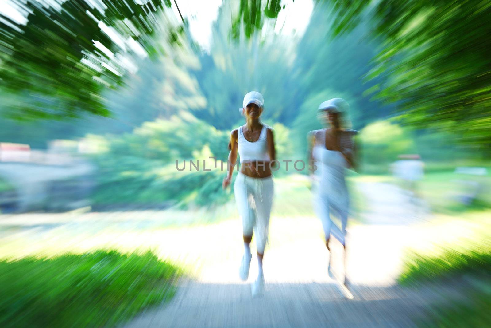 woman run by sunny park alley