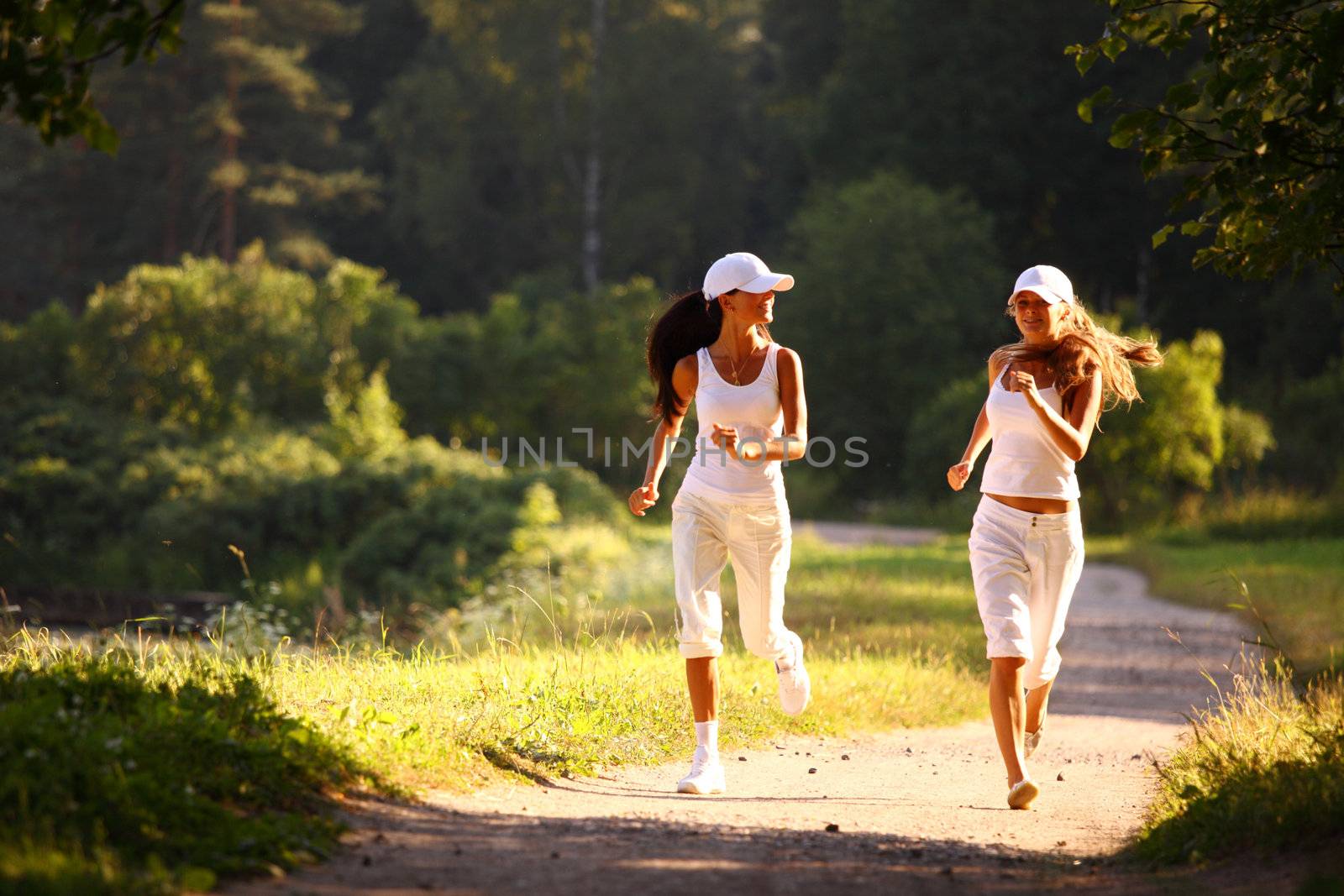 women run by sunny park alley