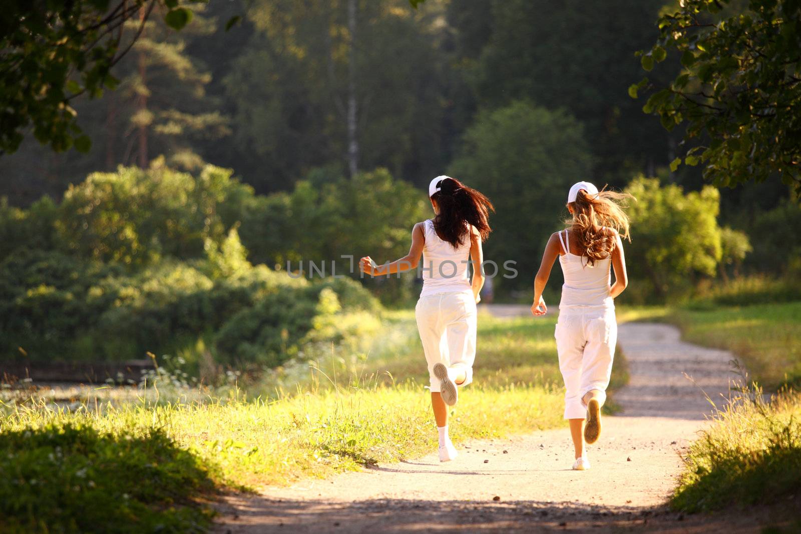 women run by sunny park alley