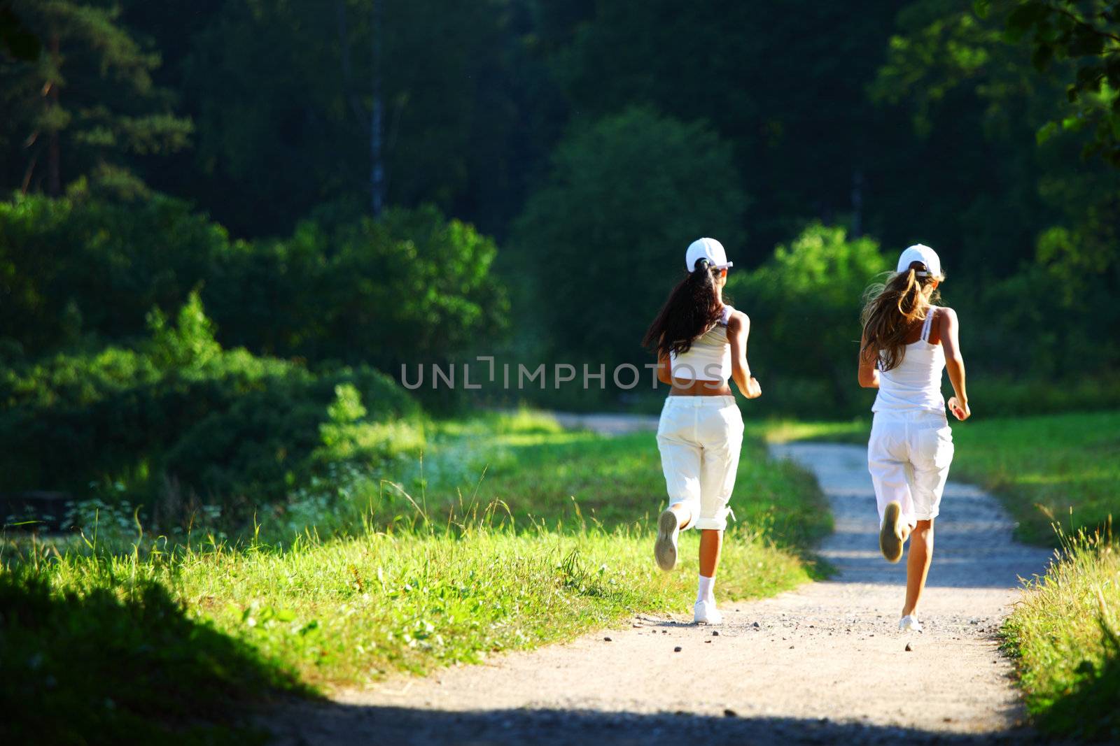 women run by sunny park alley