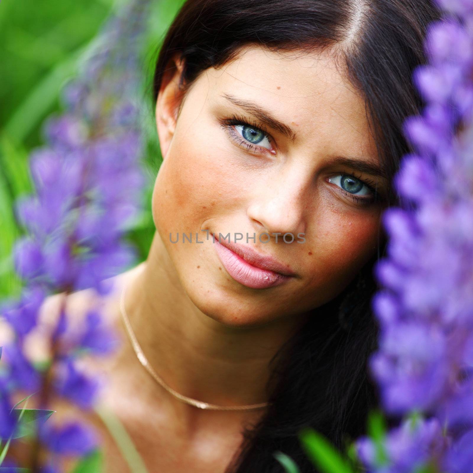 woman on pink flower field close portrait