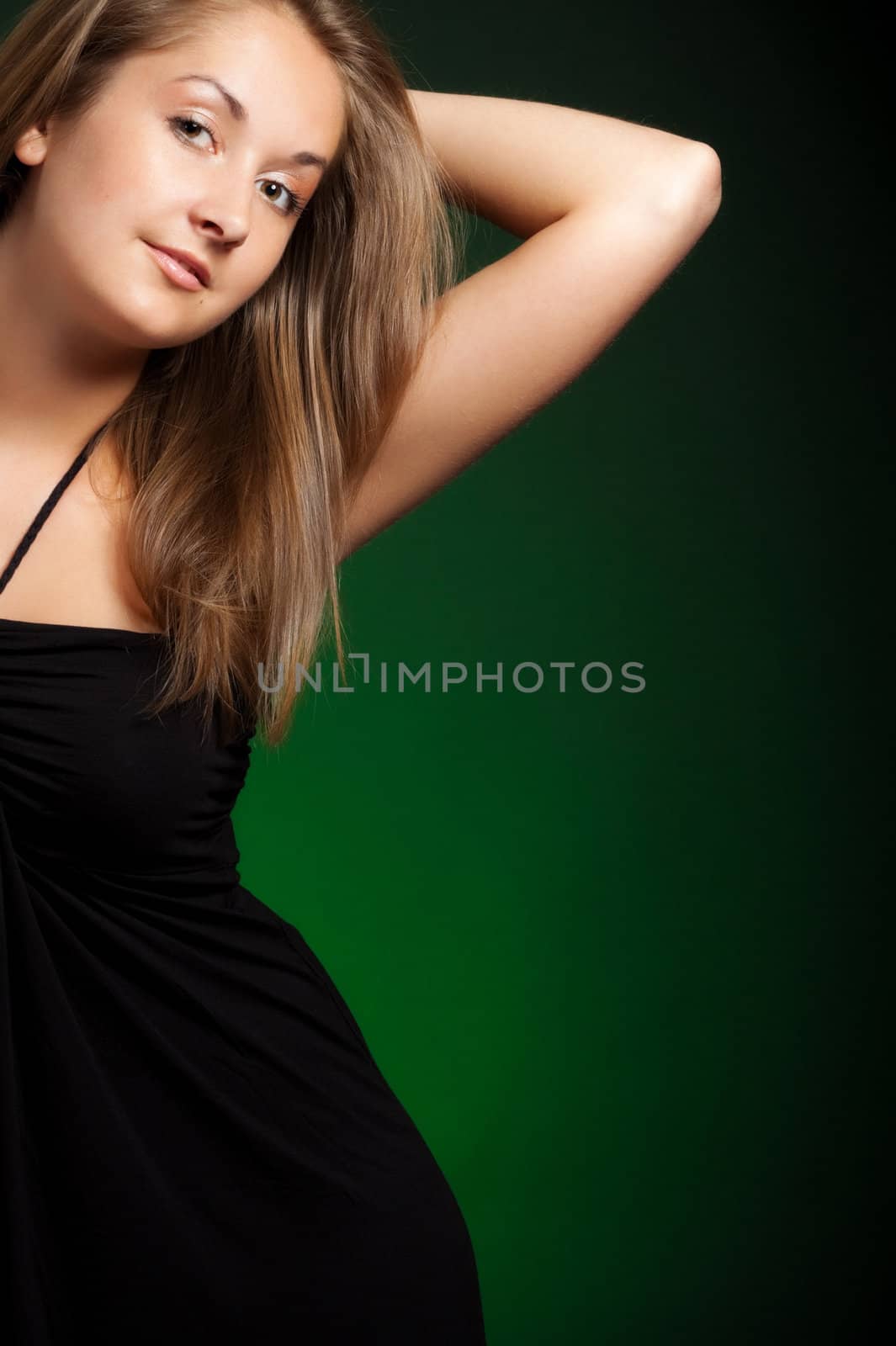 beautiful girl with long hair, green background