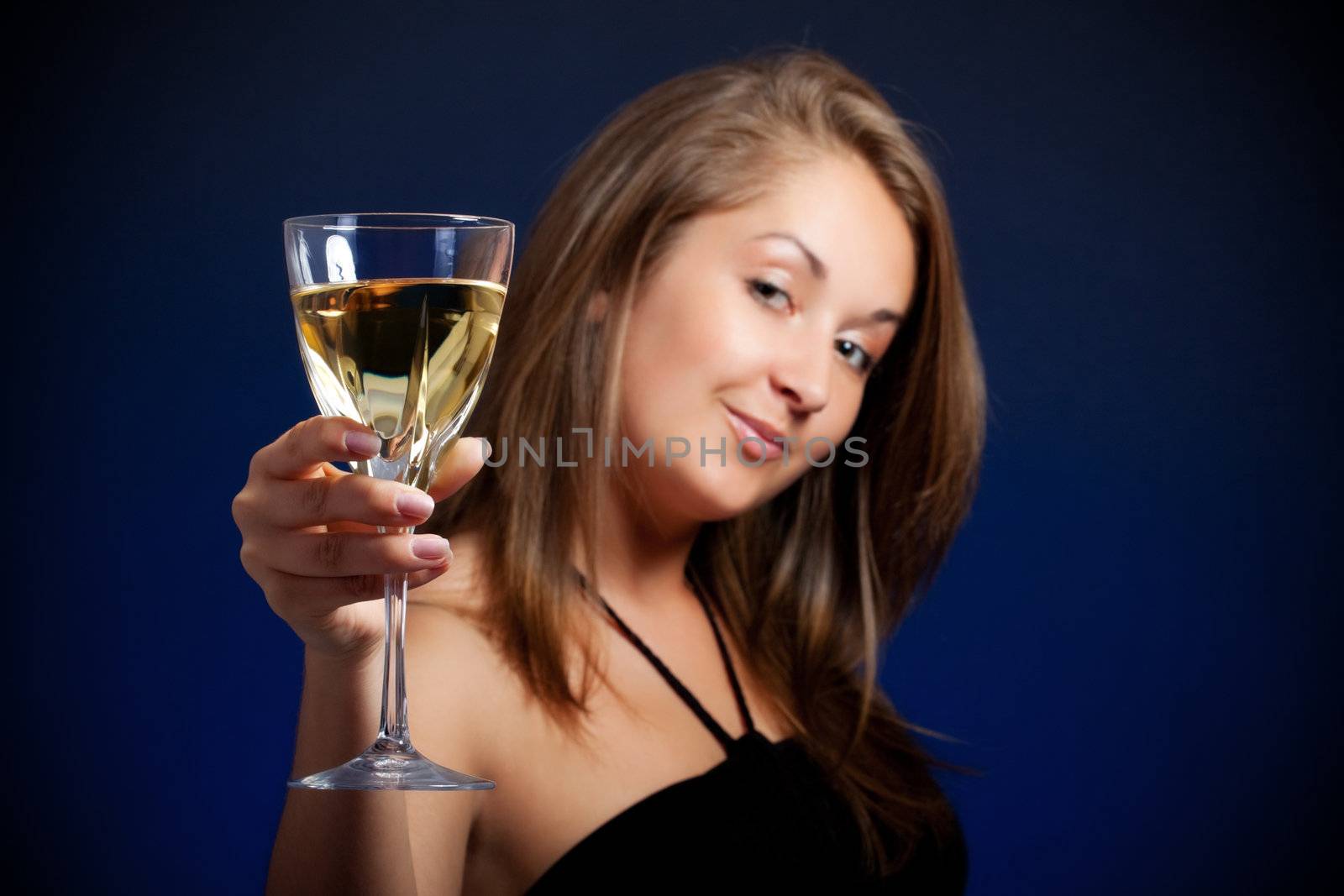 beautiful girl with glass of wine, blue background