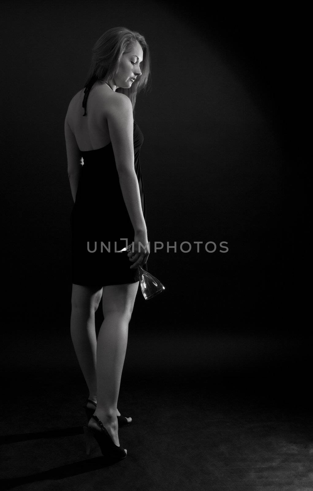 beautiful girl with empty glass, greyscale