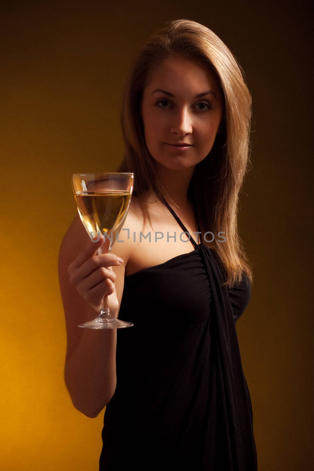 beautiful girl with glass of wine, black background