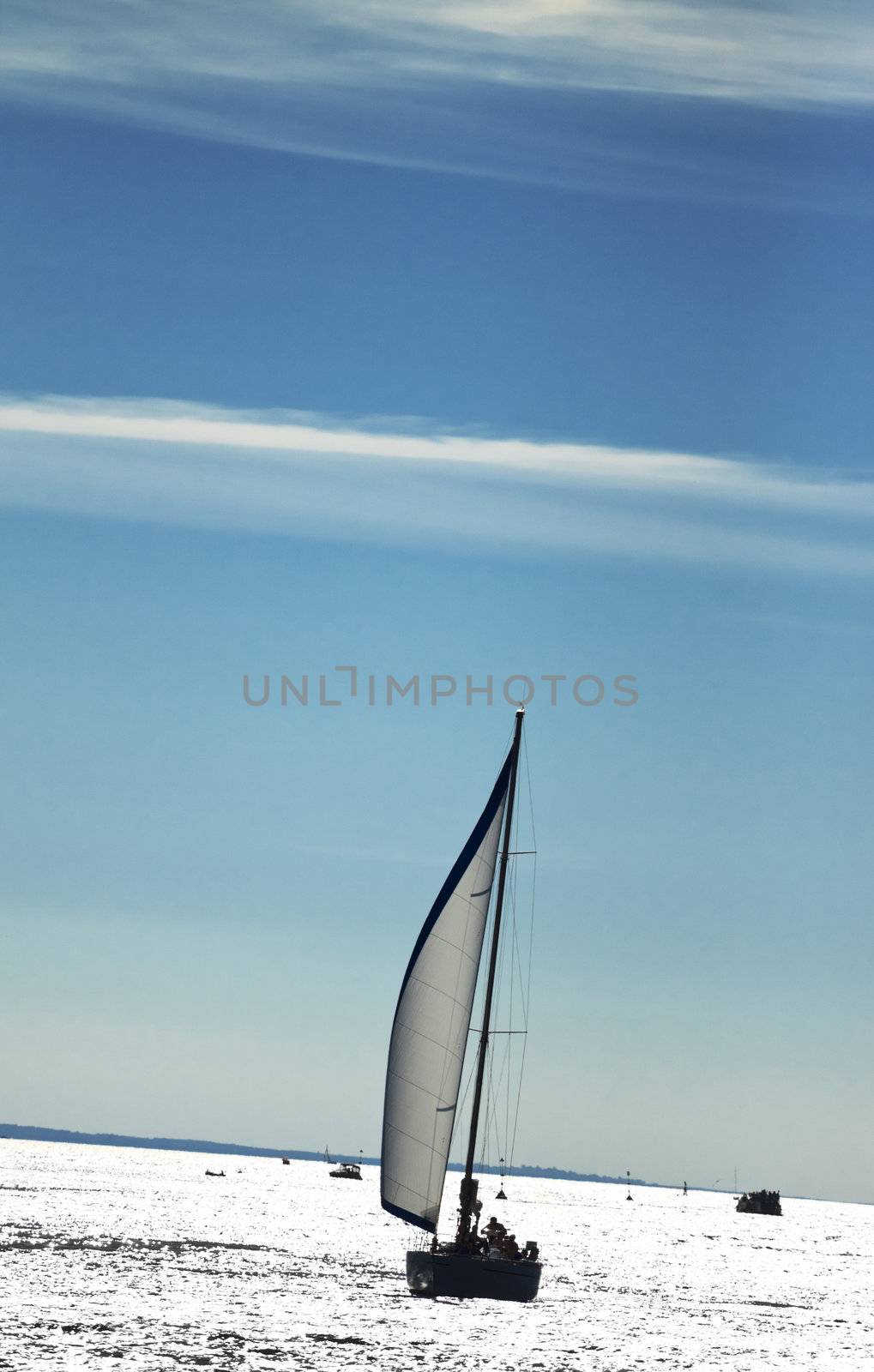 small yacht in sea under blue sky