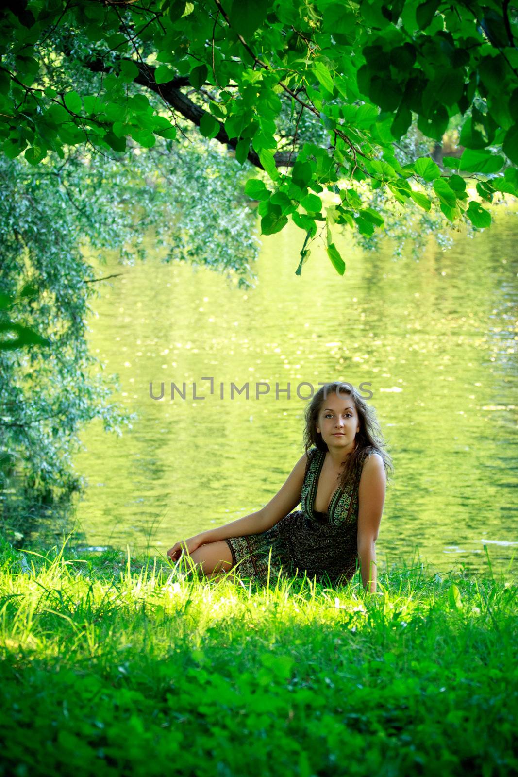 beautyful woman sitting on riverside