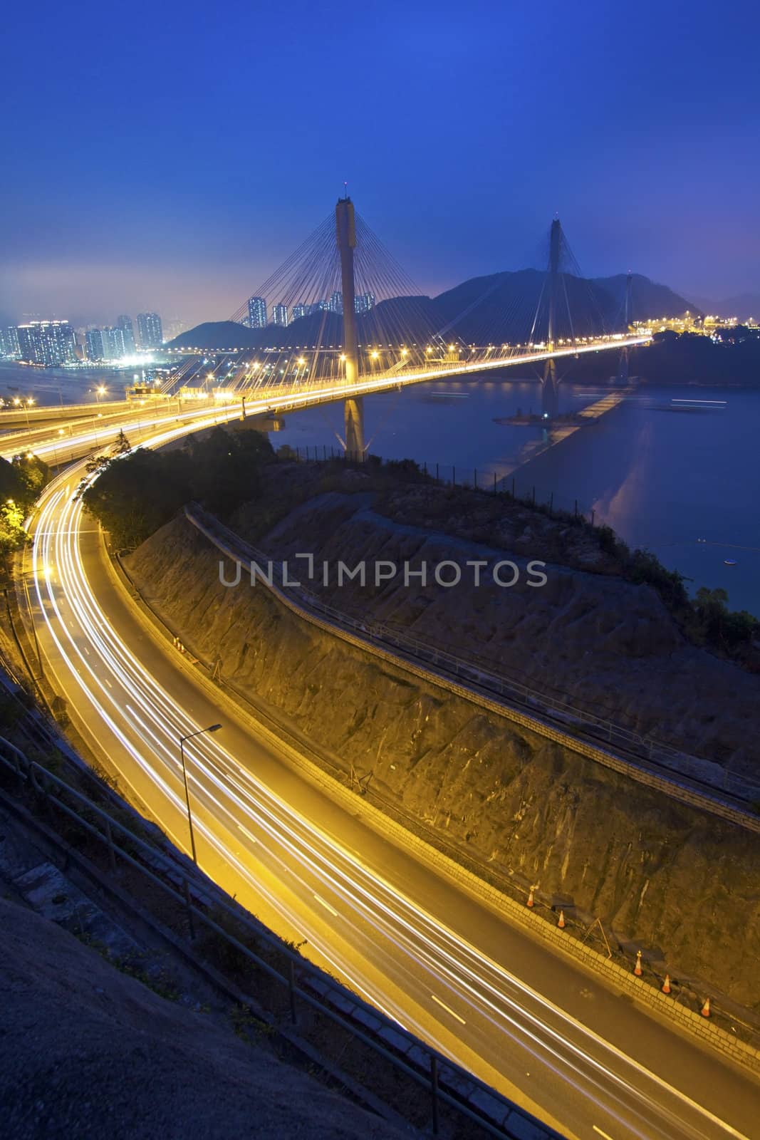 Ting Kau Bridge at night along the highway in Hong Kong by kawing921