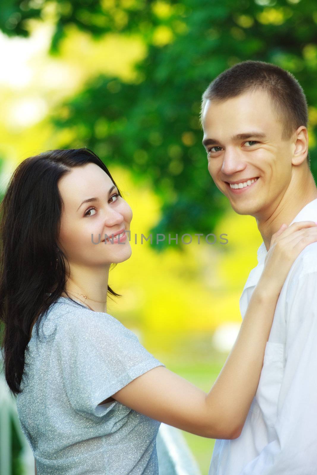 young couple in summer park by petr_malyshev