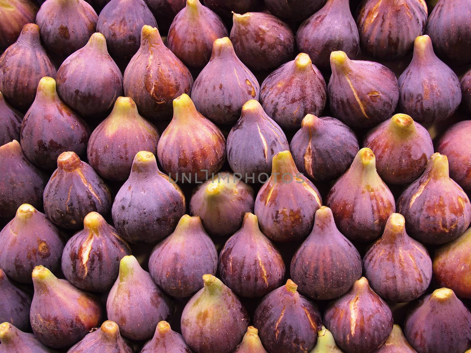 Display of fresh figs at a fruit market. Can be used as a healthy food background.