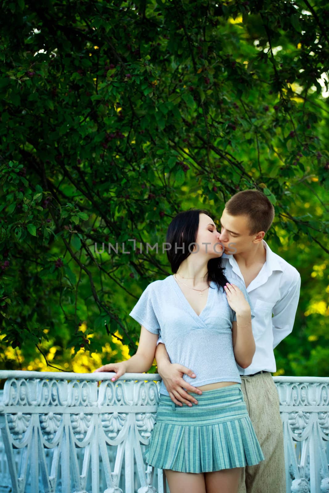 kissing couple in summer park