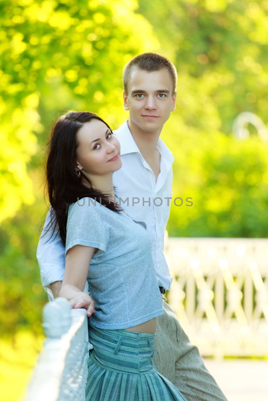 happy young couple in summer park