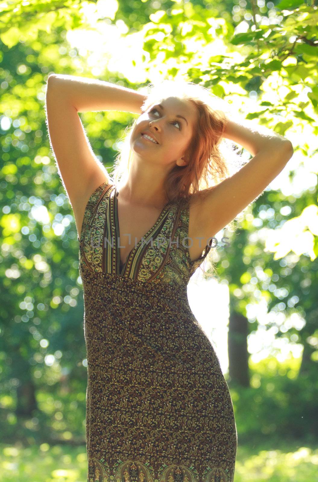 beautiful girl standing in sunshine rays