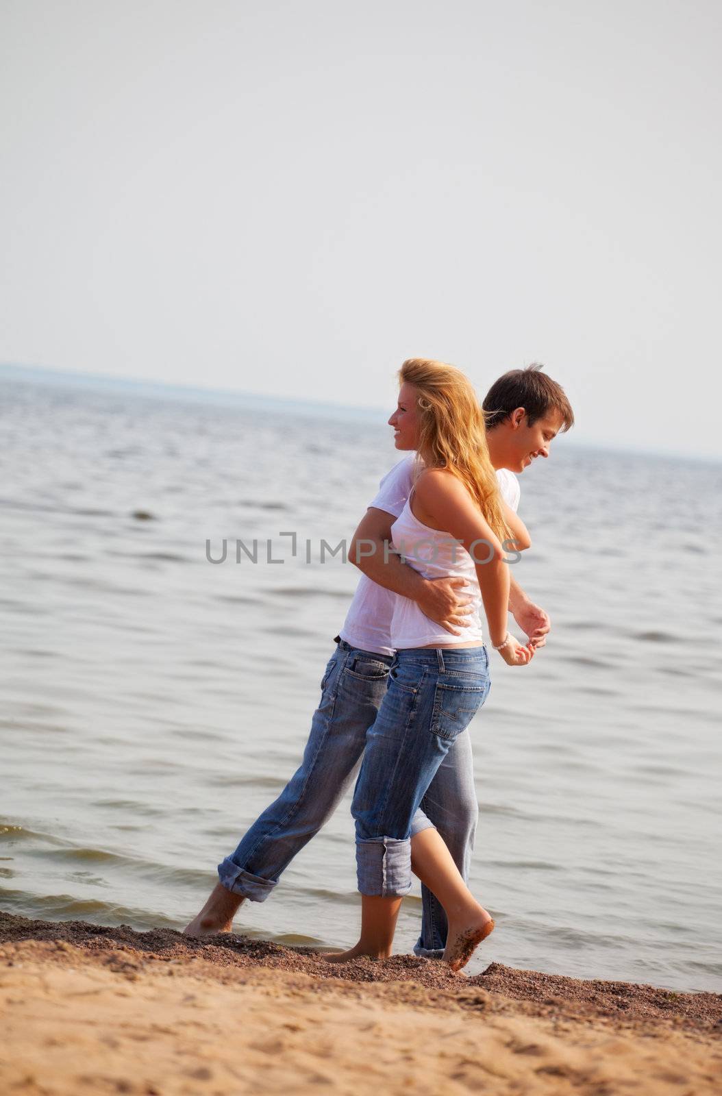 beautiful couple fun on a beach