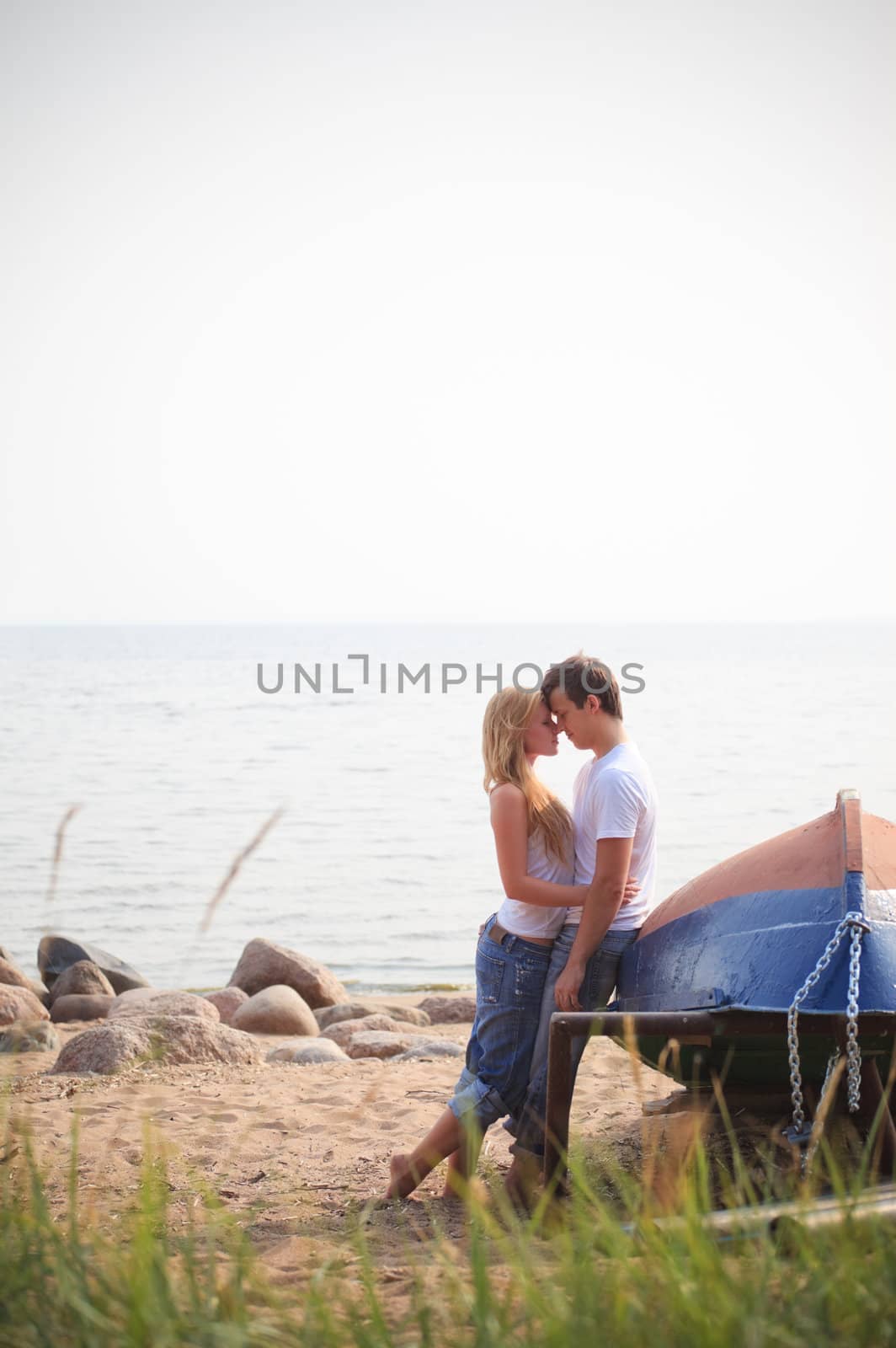 beautiful couple on a beach by petr_malyshev