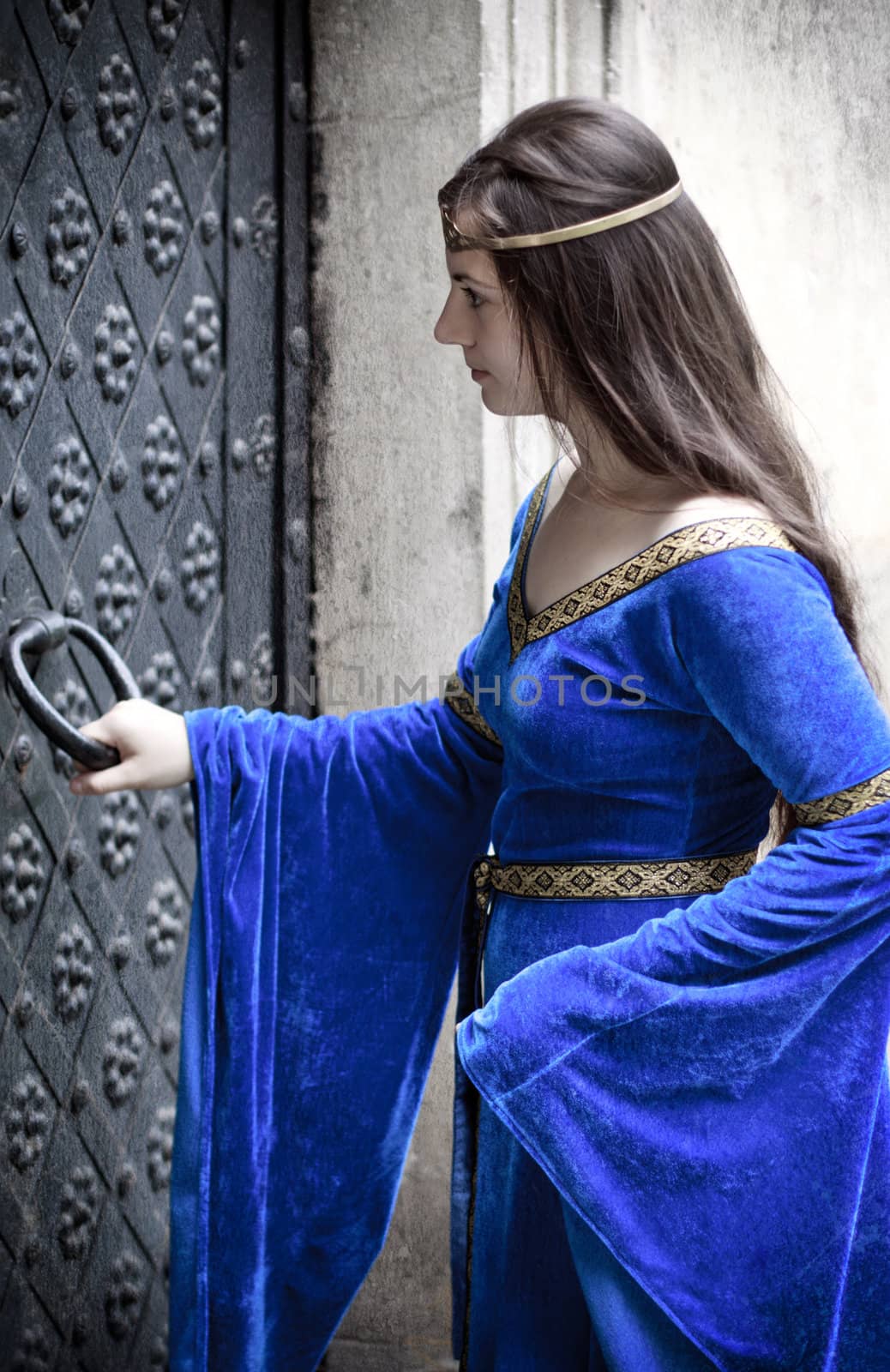 medieval girl opening door by petr_malyshev