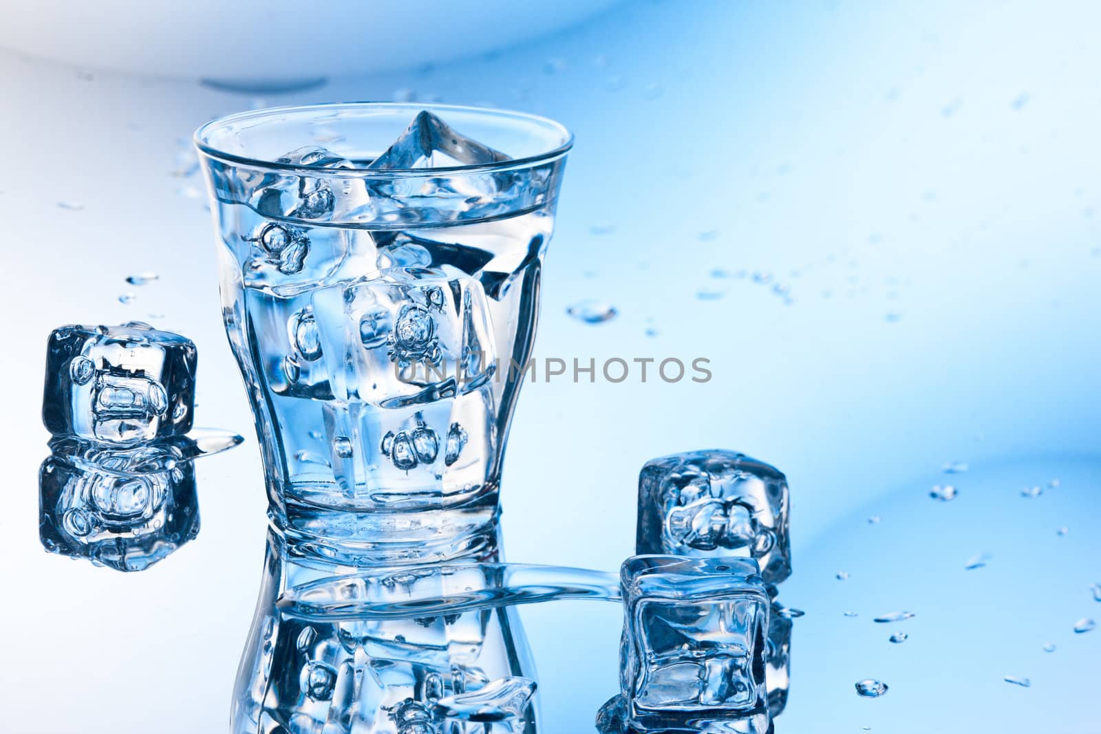 clear pure water with ice cube in glass