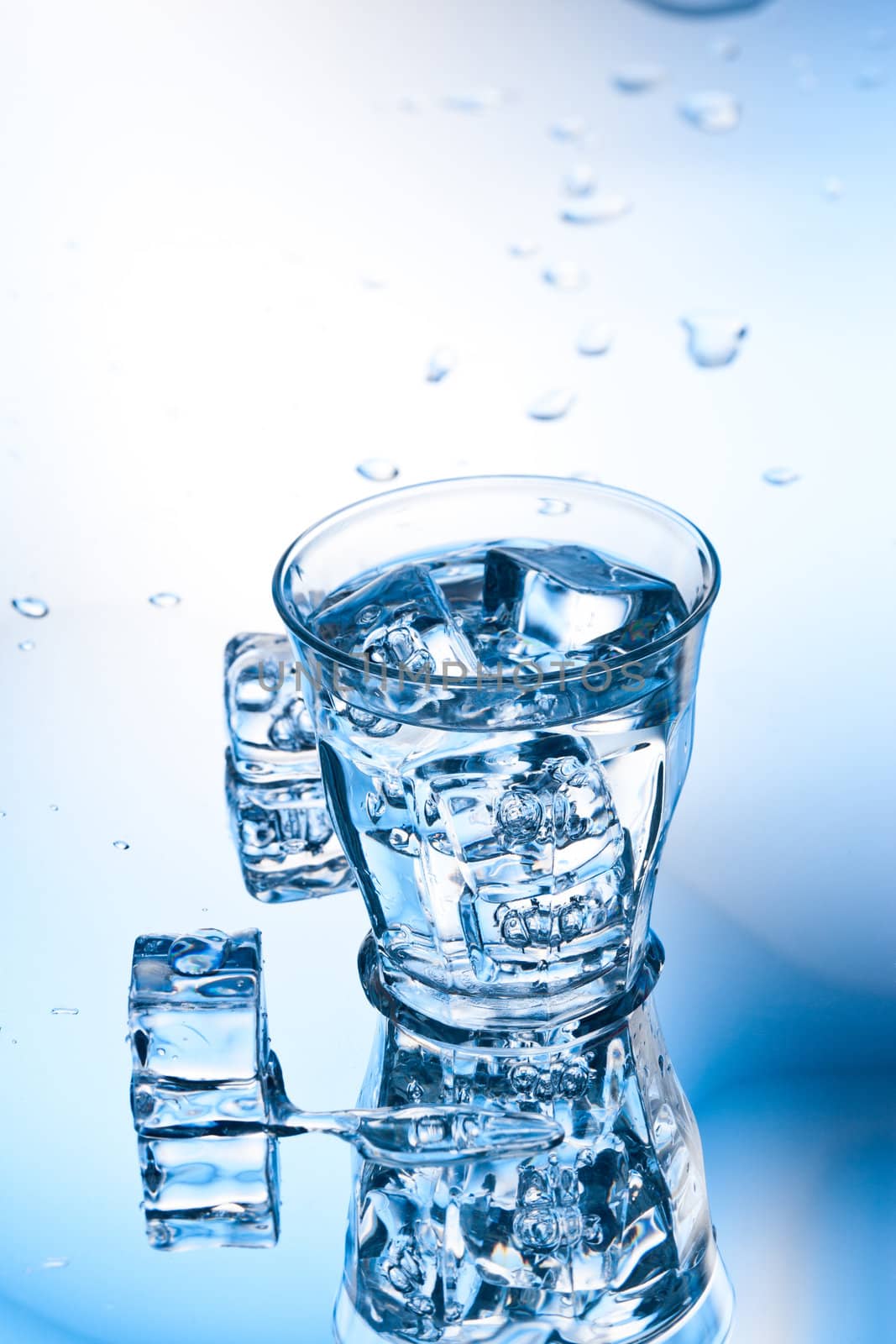 clear pure water with ice cube in glass