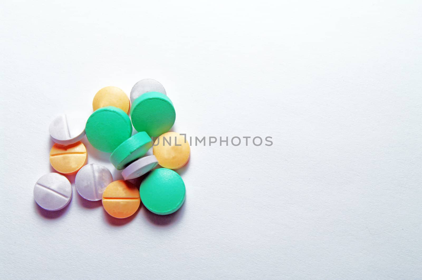 Various pills on a white background