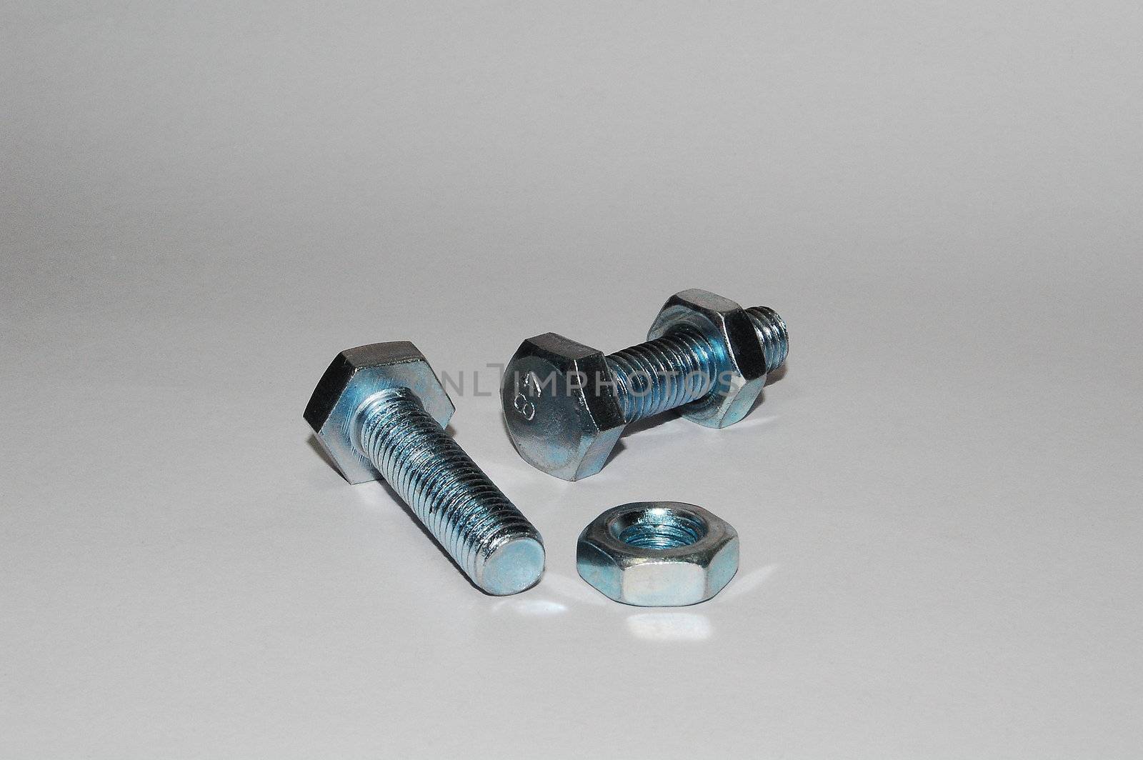 A set of shiny metal nuts and bolts for do-it-yourself  stuff or repairing/replacing old parts.