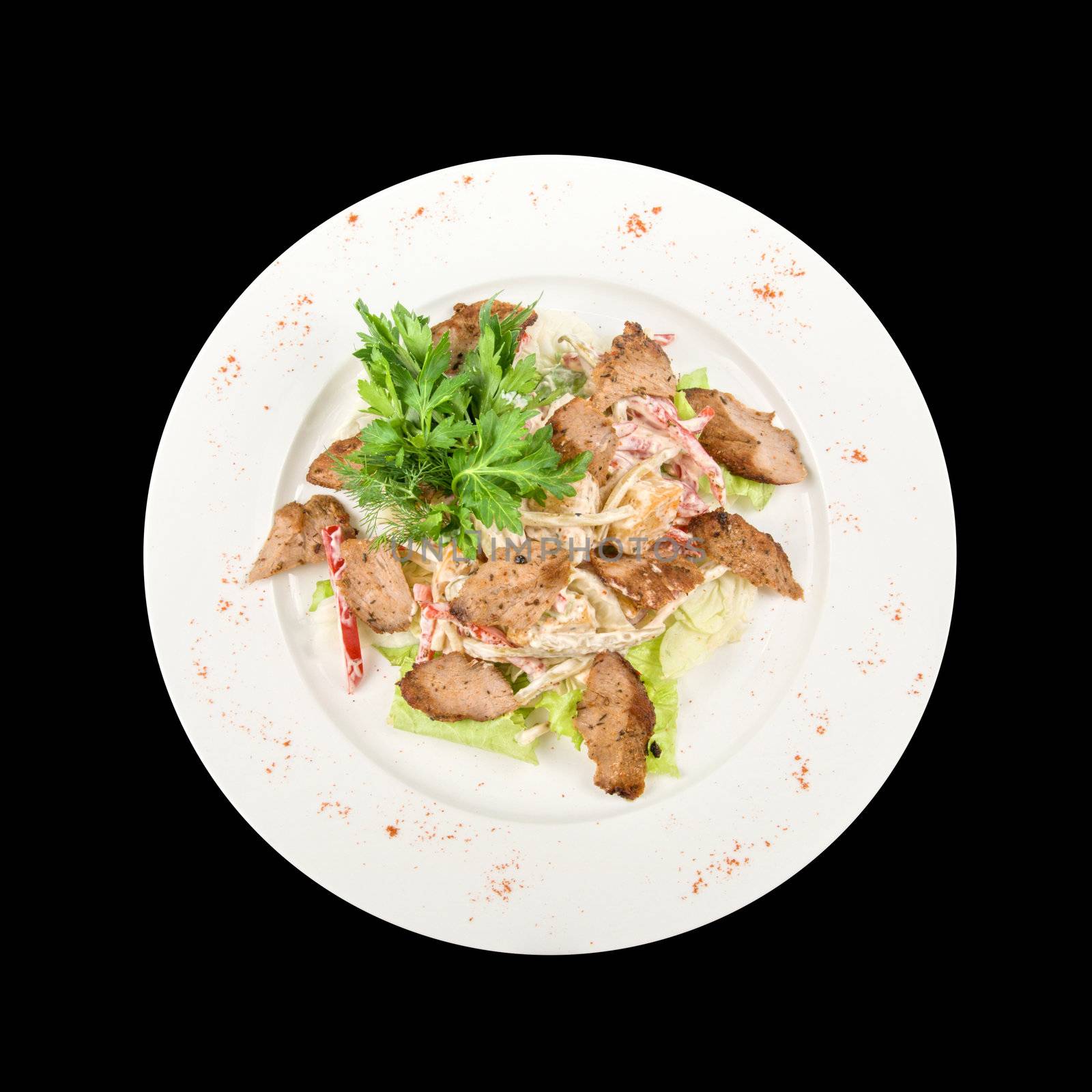 Tasty salad of meat and vegetable dish close up on a white background