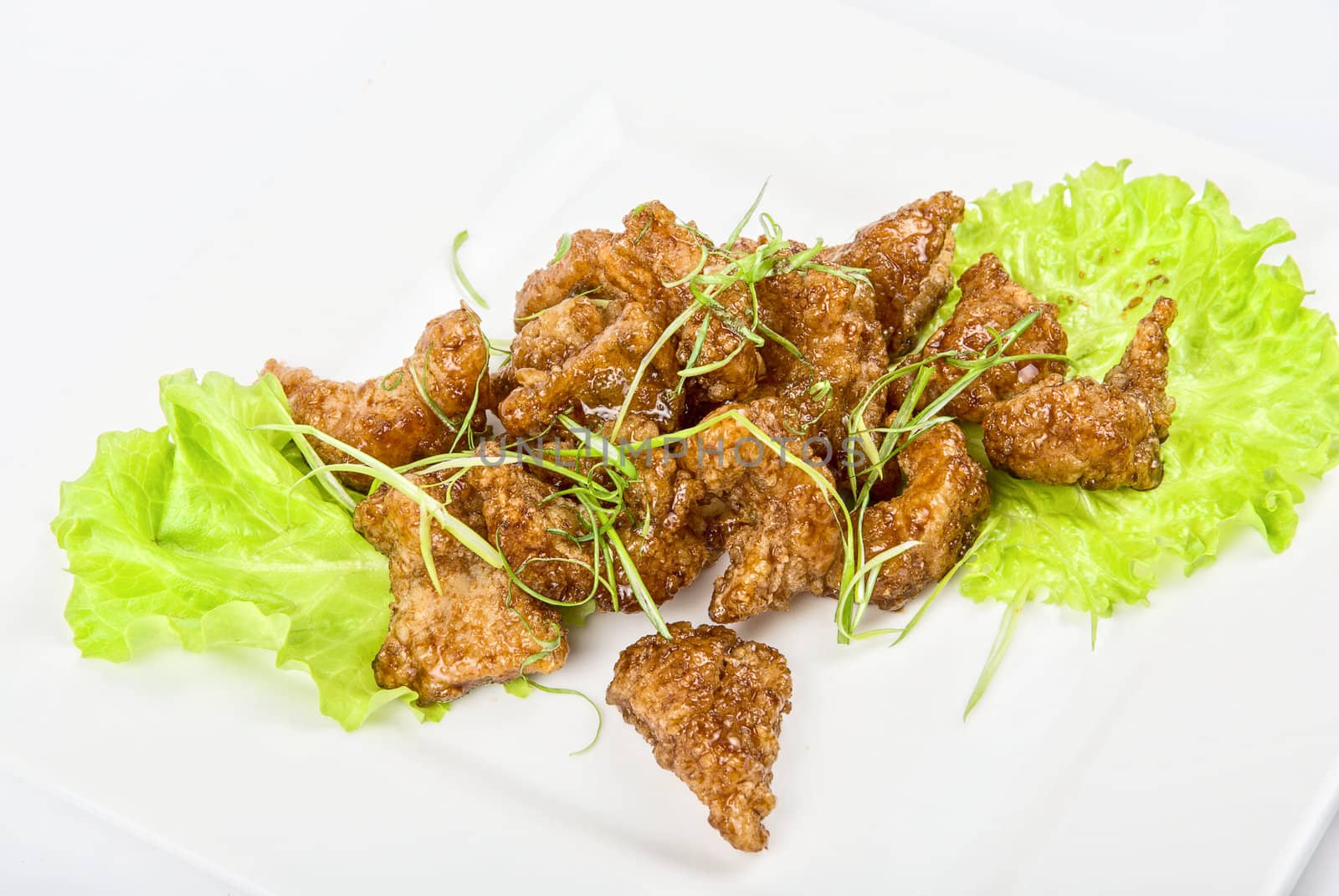 Gourmet fish fillet baked at caramel isolated on a white
