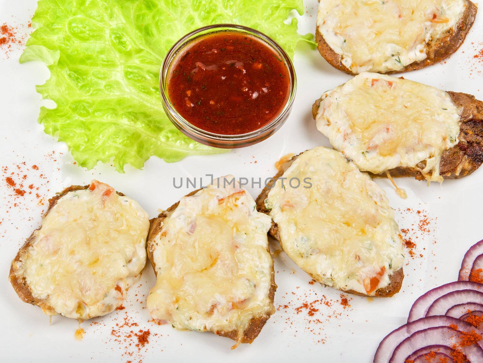 Baked beef tongue with cheese and vegetable with Salad Leaf and sauce  is a gourmet food
