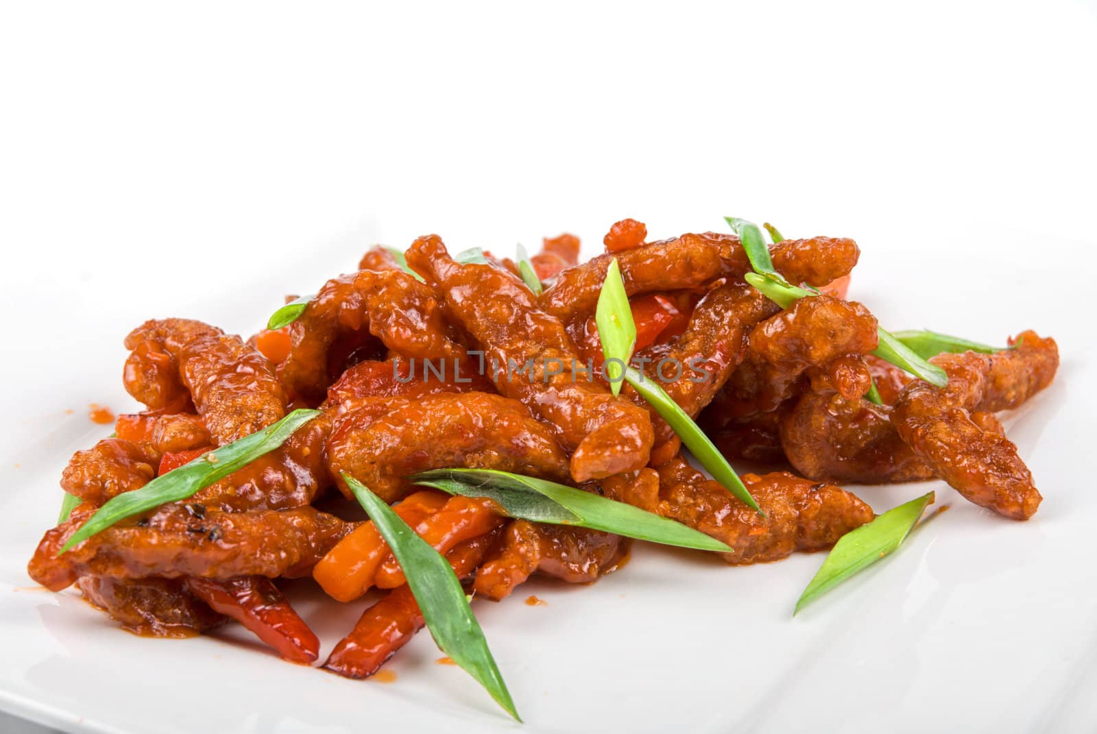 Roasted Beef at sour-sweet sauce on a white background