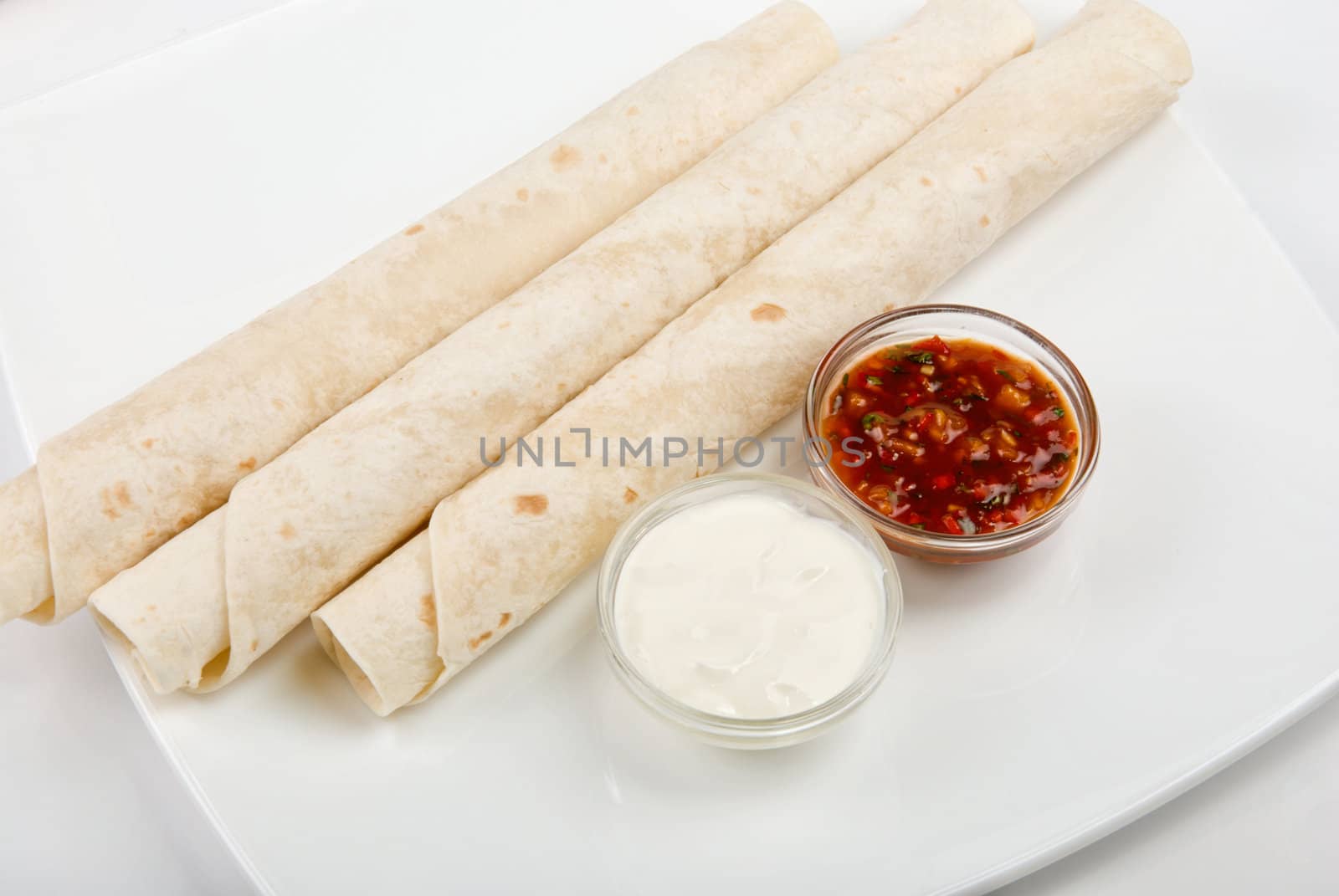 lavash tube with sauce on a white background