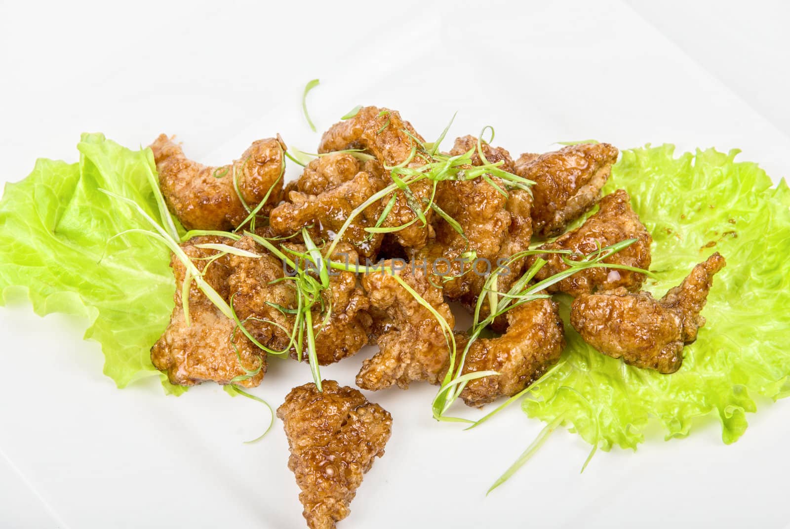 Gourmet fish fillet baked at caramel isolated on a white