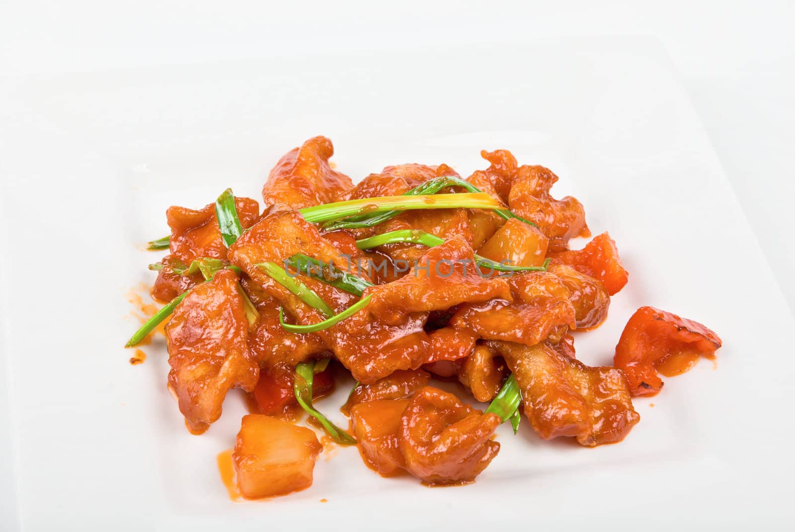 Roasted Beef at sour-sweet sauce on a white background