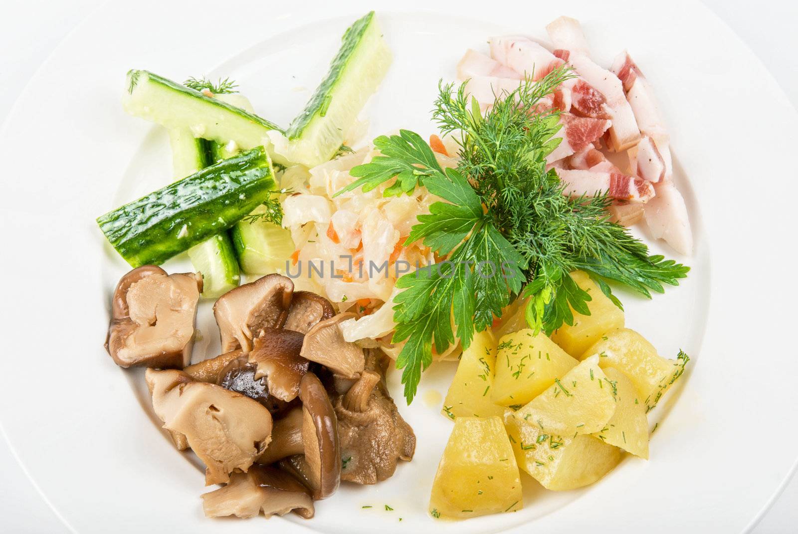 potato, fat and vegetables at white plate