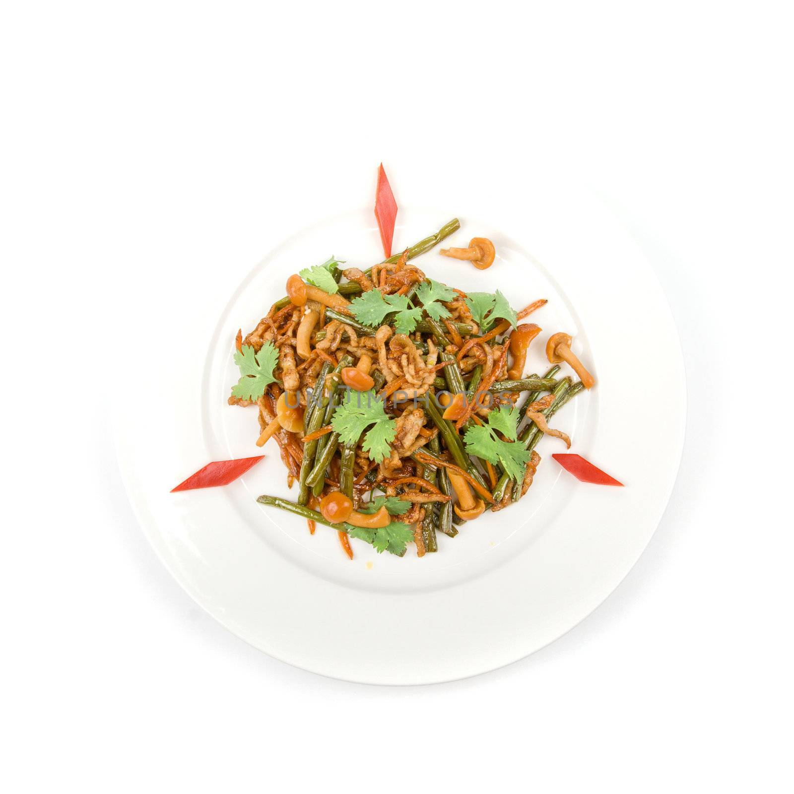 Tasty salad of mushrooms and vegetable dish close up on a white background