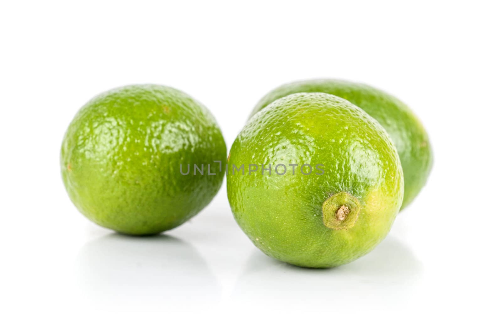 ripe brazilian limes isolated on a white background