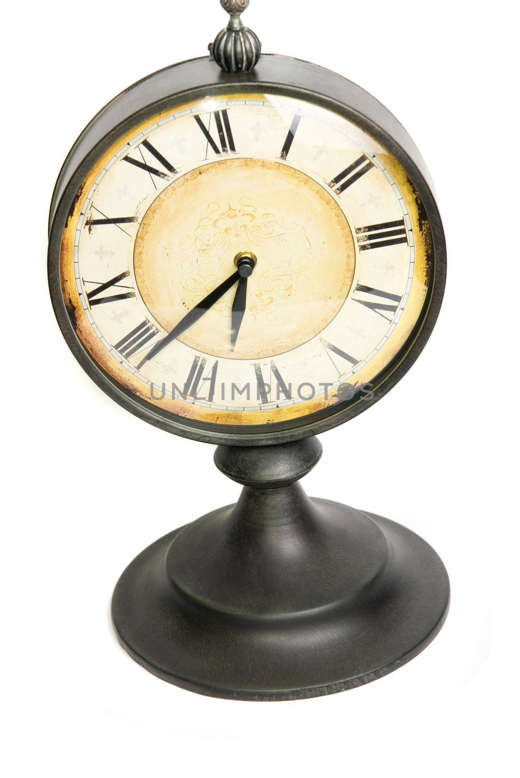 An old vintage clock isolated on a white background