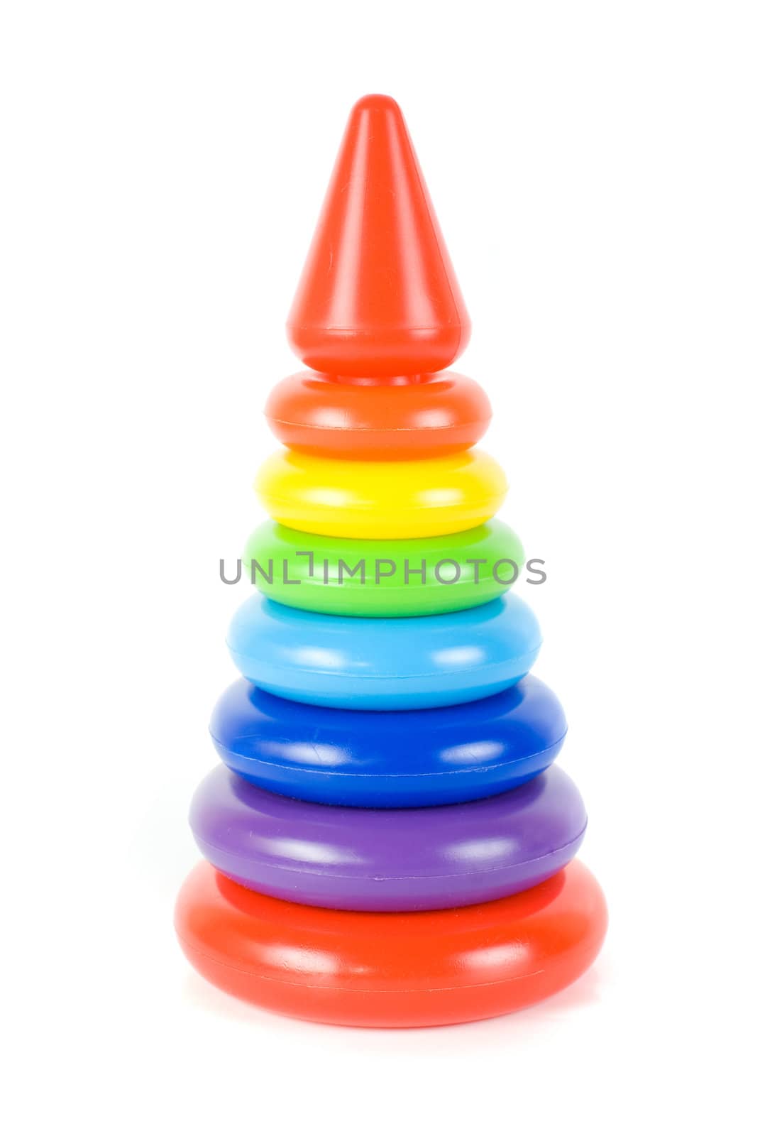 Plastic toy pyramid on a white background