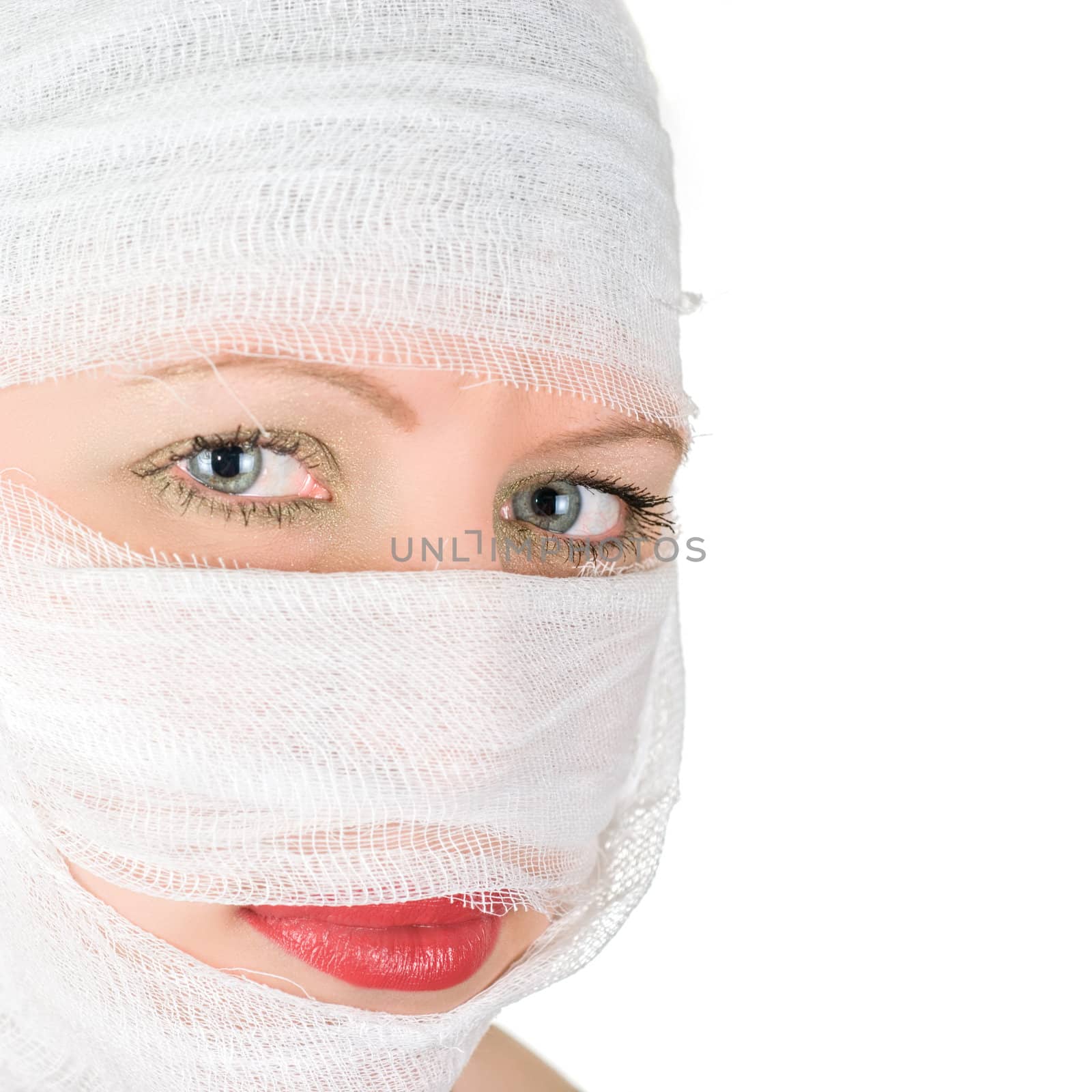 woman with bandages on her face on white