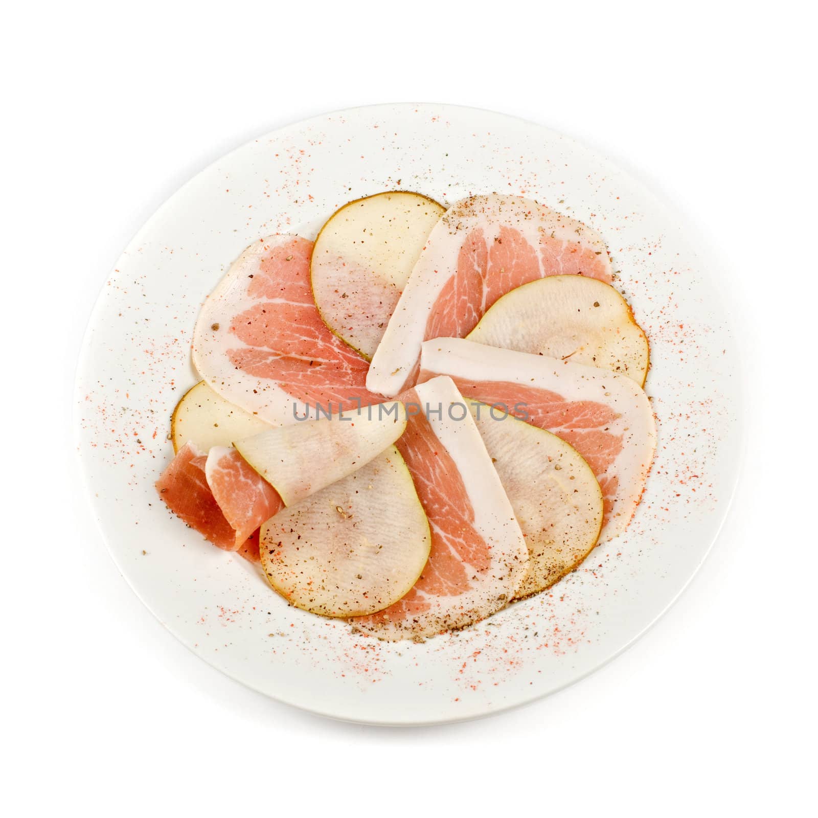 Sliced bacon with sliced pear decorated isolated on a white