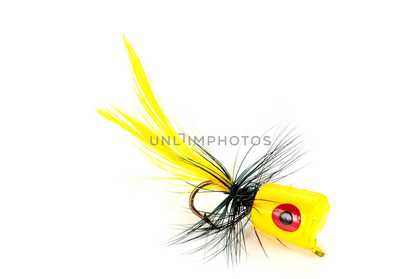 popper cork yellow and black with a hook for fishing on white background