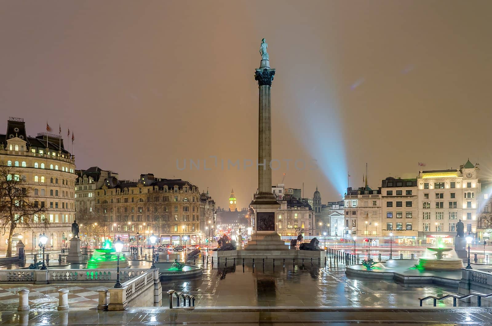 Trafalgar Square at night with the Big Ben on the background, London, UK